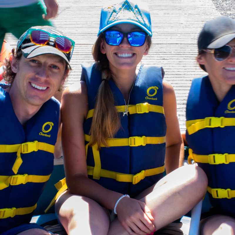 a group of people sitting at a beach